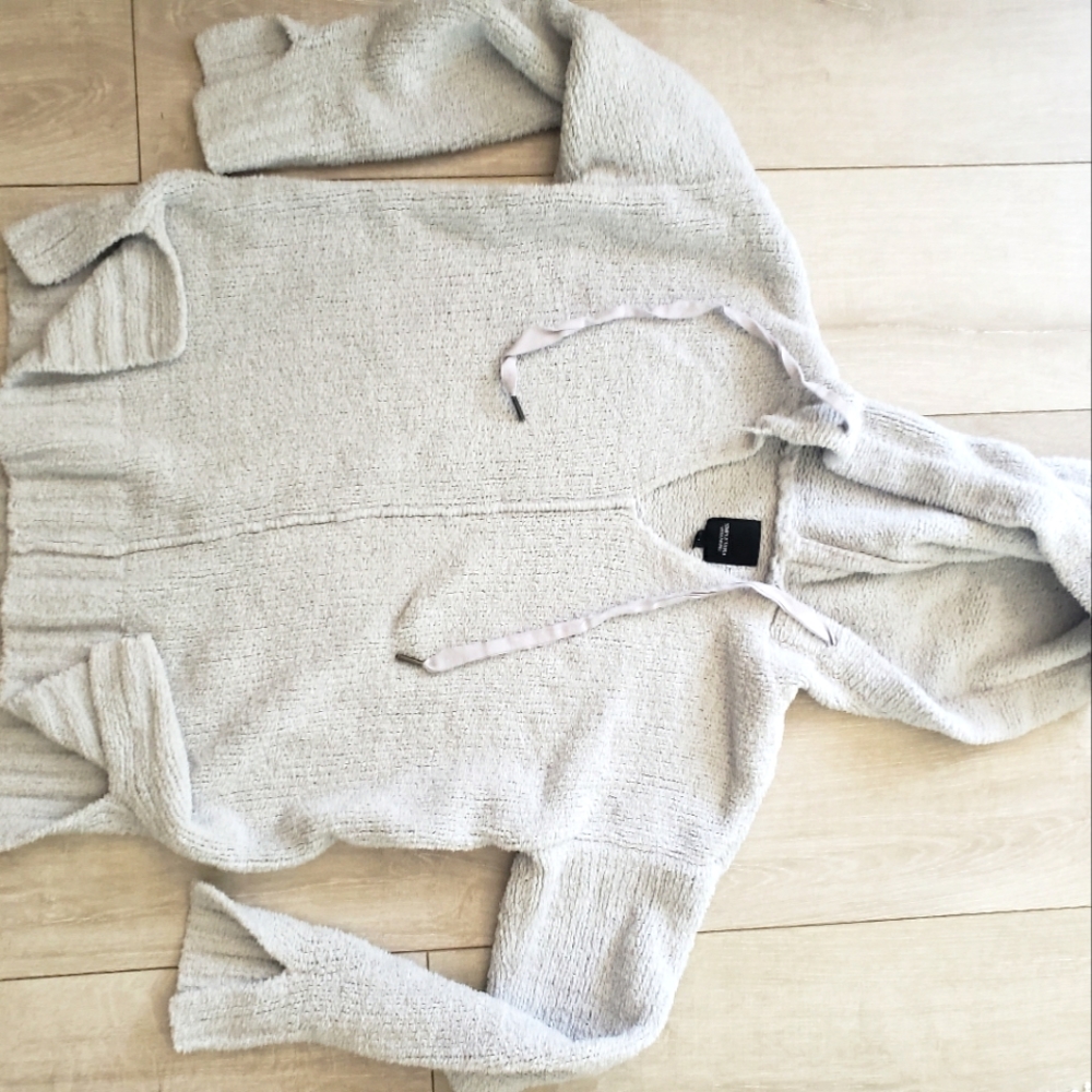 Lite blue sweater  vera wang has a couple loose stitches , hoodie